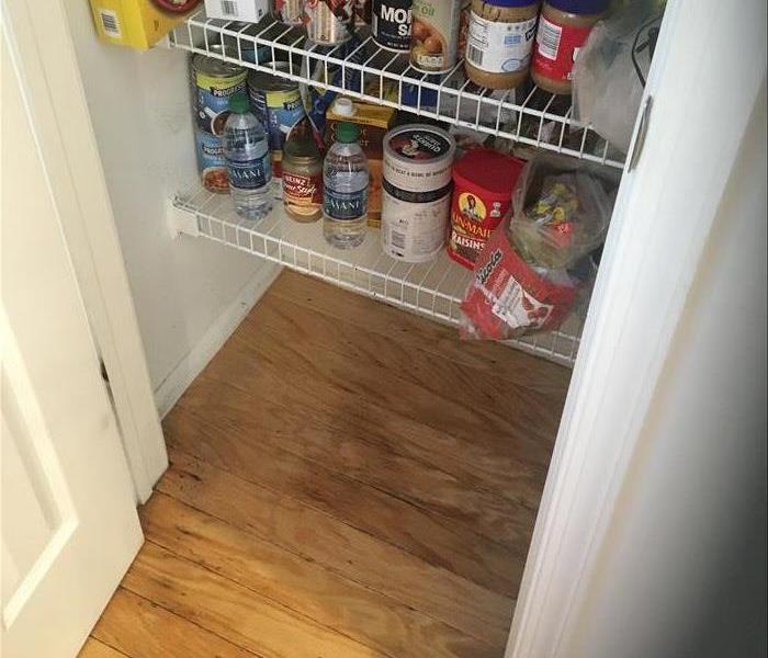 wet floorboards in this kitchen food pantry and trim