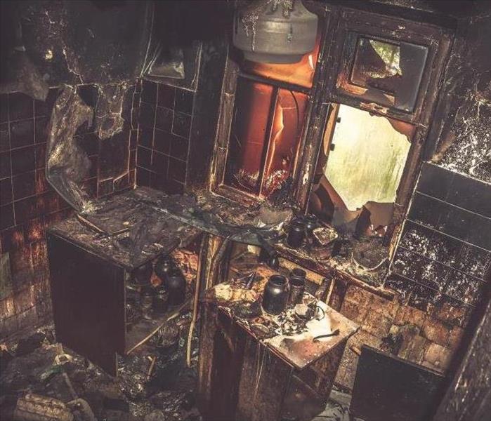 burned room in a home, interior inside, furniture and utensils