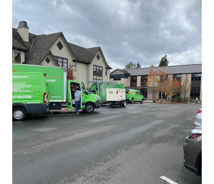 a SERVPRO truck parked outside of a store